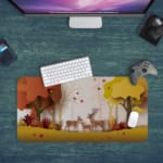 Infidu Explore Nature Desk Mat features a colorful nature scene with deer, autumn-colored trees, and falling leaves in yellow and red tones. Desk Pad kept on a plain blue background