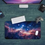 Infidu Space Desk Pad featuring a swirling nebula in orange, pink, and blue set against a starry space background. Desk Pad on the computer table