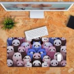 Infidu Bring Panda Playfulness Desk Mat with anime-style pandas, designed by our digital artists. Perfect for adding fun to your desk setup. Desk Pad kept on a plain orange background