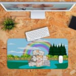 Infidu Bring Cat Magic Desk Mat featuring an anime cat in orange, white, and gray, with animals, trees, and a rainbow background, perfect for kids' desks. Desk Pad kept on a plain orange background