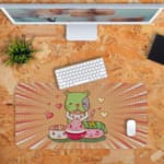 Infidu Bring Cat Magic Desk Mat featuring a cute cat with a green and blue face, surrounded by hearts and a playful radial burst background. Desk Pad kept on a plain orange background