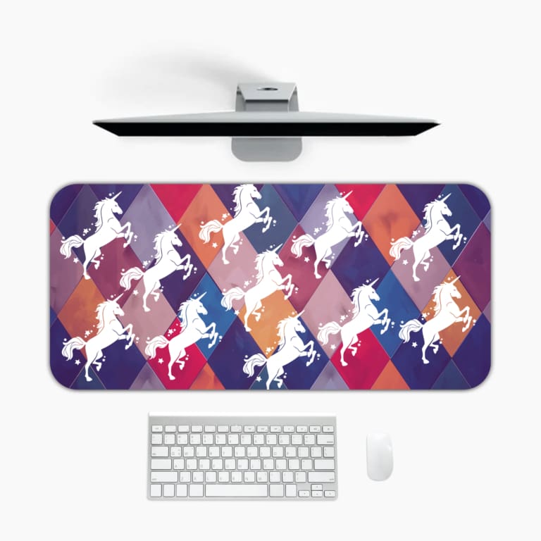 Unicorn Desk Mat with a white unicorn on a colorful background of green, yellow, navy blue, blue, and gray. Desk Pad kept on a plain white background