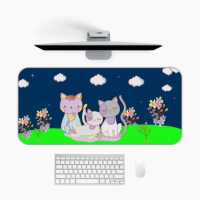 Infidu Bring Cat Magic Desk Mat featuring anime cats with a navy blue sky, clouds, and floral designs. Perfect for adding charm to any desk. Design Kept on a computer table