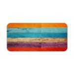 Desk pad with a vibrant striped wood texture design featuring bold colors like orange, light blue, beige, purple, and red. Desk Pad kept on a plain white background