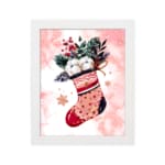 Christmas wall art featuring a pink stocking with red accents, filled with green leaves, berries, and white snowball-like objects, on a light pink background with star patterns, framed in black a plain white background with white frame