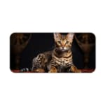 Striped cat with light brown and black fur on a dark background. Elegant and detailed design, high-quality desk pad. Desk Pad kept on a plain white background