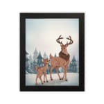 Winter-themed wall art with a reddish-brown deer, blue trees, and a light, snowy background in a watercolor style with a plain white background in a black frame