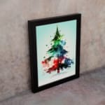 Watercolor Christmas tree painting with green, blue, and red colors, topped with a yellow star, framed in black. on the wall in a black frame