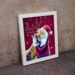 Framed artwork of a cartoon-style Santa with antlers and a red and purple outfit on a pink background with white stars. displayed on the wall on a white frame