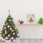 Christmas wall art featuring a white tree with red ornaments, gifts underneath, a reindeer, and a snowy background in a watercolor style. displayed on the table in white frame