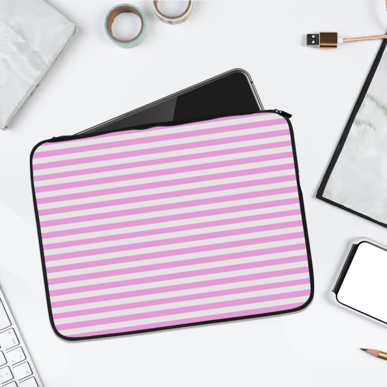 Light pink laptop sleeve with white horizontal stripes, offering a clean and minimalist design. laptop sleeve kept on a plain white background