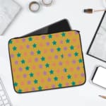 Infidu Green and Pink Star Pattern Laptop Sleeve with small green and pink stars on a light green background, displayed on a desk. laptop sleeve kept on a plain white background