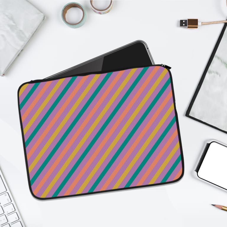 Colorful striped laptop sleeve with shades of blue, pink, yellow, and purple, offering a vibrant, playful design. laptop sleeve kept on a plain white background