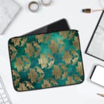 Elegant floral teal-blue laptop sleeve with beige and gold flowers, offering stylish protection for your laptop. laptop sleeve kept on a plain white background