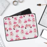 Infidu pink & white laptop sleeve with coffee cups, sofas, and hearts design on a white background. laptop sleeve kept on a plain white background