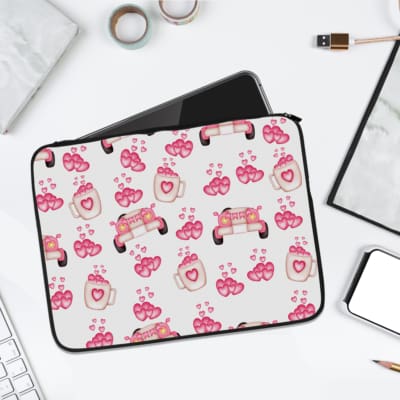 Infidu pink & white laptop sleeve with coffee cups, sofas, and hearts design on a white background. laptop sleeve kept on a plain white background