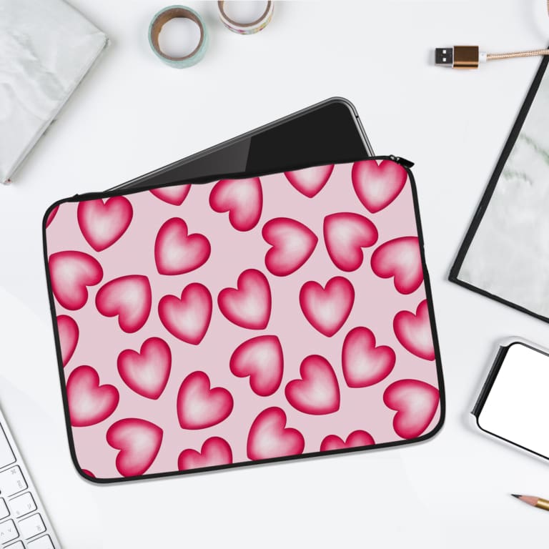 Infidu Pink Heart Pattern Laptop Sleeve with a playful design of large, evenly spaced pink hearts on a light pink background. laptop sleeve kept on a plain white background