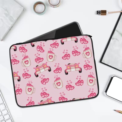 Infidu pink & white laptop sleeve with coffee cups, sofas, and hearts design on a white background. laptop sleeve kept on a plain white background