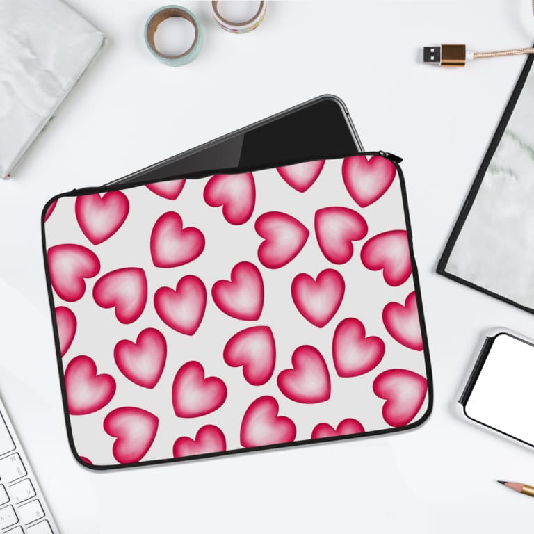 Infidu White Laptop Sleeve with a Large Pink Heart Design, featuring a cheerful pattern of pink hearts on a white background. laptop sleeve kept on a plain white background