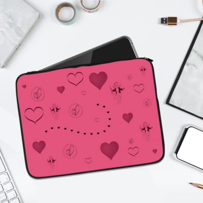 Infidu pink laptop sleeve with heart designs and dotted lines in shades of pink and purple. laptop sleeve kept on a plain white background