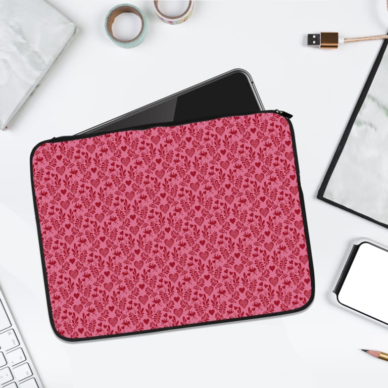 Infidu pink floral textured laptop sleeve with a delicate pattern and secure zip. laptop sleeve kept on a plain white background