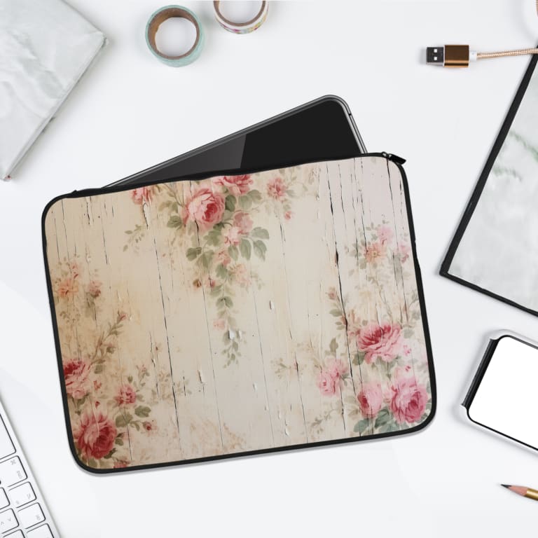 Infidu Rustic Floral Laptop Sleeve with pink, red, and green flowers on a white wood textured background. laptop sleeve kept on a plain white background