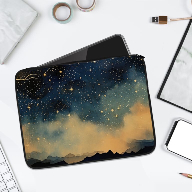 Laptop sleeve with a dark blue background featuring a starry night sky design with stars, clouds, and gradient effect. laptop sleeve kept on a plain white background