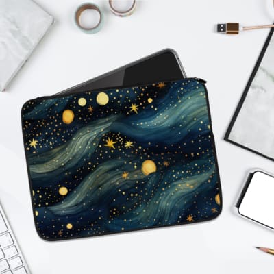 Laptop sleeve with a cosmic galaxy design featuring blue waves, stars, and planets in yellow, gold, and white. laptop sleeve kept on a plain white background