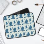 White laptop sleeve with a blue tree pattern for a nature-inspired look. laptop sleeve kept on a plain white background