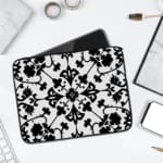 Infidu black and white mandala art laptop sleeve with intricate floral design. laptop sleeve kept on a plain white background