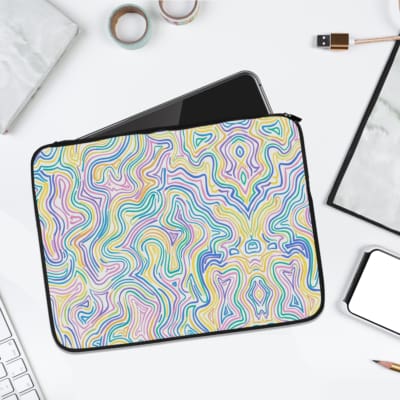 Pastel wavy lines in blue, green, pink, and purple on a marble background, create a soft, calming laptop sleeve design. laptop sleeve kept on a plain white background