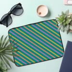 Infidu Colorful Striped Diagonal Lines Laptop Sleeve in green, blue, yellow, and pink. the laptop sleeve on the table