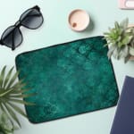 Infidu dark green laptop sleeve with textured pattern design the laptop sleeve on the table