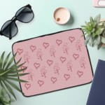 Infidu Light Pink Heart Outline Laptop Sleeve -Delicate Laptop Protection the laptop sleeve on the table