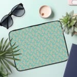 Infidu Simple Light Blue Pattern Laptop Sleeve with subtle design on a light background, featuring zip closure for easy access and protection. the laptop sleeve on the table