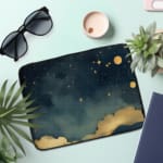 Infidu Night Sky Laptop Sleeve with Stars, Moon, and Clouds design on a dark blue background, offering a dreamy celestial theme for laptop protection. the person holding the sleeve