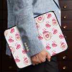 Infidu Cute Pink Heart Print Laptop Sleeve with pink heart pattern on white background, perfect for stylish laptop protection. the person holding the sleeve