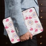 Infidu Cute Pink Heart Print Laptop Sleeve with Blue heart pattern on white background, perfect for stylish laptop protection. the person holding the sleeve