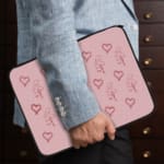 Infidu Light Pink Heart Outline Laptop Sleeve -Delicate Laptop Protection the person holding the sleeve