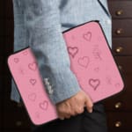 Infidu Light Pink Heart Outline Laptop Sleeve -Delicate Laptop Protection the person holding the sleeve