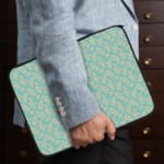 Infidu Simple Light Blue Pattern Laptop Sleeve with subtle design on a light background, featuring zip closure for easy access and protection. the person holding the sleeve