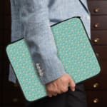 Infidu Light Blue Laptop Sleeve with White Star Pattern – Simple and stylish design to protect your laptop. the person holding the sleeve