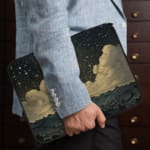 Infidu Night Sky Clouds Stars Laptop Sleeve with dark background, stars, and clouds design. the person holding the sleeve