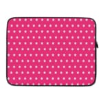 Pink laptop sleeve with a repeating white star pattern, shown against a bright background. laptop sleeve kept on a plain white background