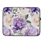 Elegant floral laptop sleeve with purple flowers and green leaves on a soft, light background. laptop sleeve kept on a plain white background