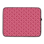 Pink laptop sleeve with a red heart pattern on a light surface. laptop sleeve kept on a plain white background