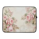 Elegant soft pink floral vintage laptop sleeve with light pink roses and green leaves on a pale background, designed for laptop protection. laptop sleeve kept on a plain white background