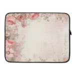 Soft beige laptop sleeve with delicate floral design in pink, green, and purple, featuring a zip closure for secure storage. laptop sleeve kept on a plain white background