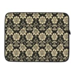 Infidu laptop sleeve with gold floral pattern on a black background. laptop sleeve kept on a plain white background