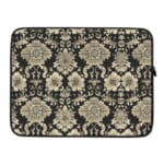 Laptop sleeve with elegant white floral and leaf motifs on a black background, featuring durable fabric and a secure zip closure. laptop sleeve kept on a plain white background